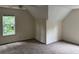 Bedroom with neutral carpet, ceiling fan, one window, and sloped ceilings at 6280 Autry Mill Rd, Cumming, GA 30028