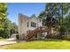 This home has a two-car garage, a deck, and a large backyard at 6280 Autry Mill Rd, Cumming, GA 30028