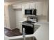 The kitchen features a stainless steel sink, a new oven, and white countertops at 6280 Autry Mill Rd, Cumming, GA 30028