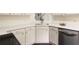 Bright kitchen features white cabinets, quartz countertops, and stainless steel dishwasher at 6280 Autry Mill Rd, Cumming, GA 30028