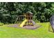 A playground with a slide, swings, and climbing wall at 6280 Autry Mill Rd, Cumming, GA 30028