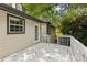 View of the back of the house featuring a small deck at 6441 Michell Way, Douglasville, GA 30135