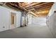 Spacious unfinished basement with exposed ceiling, concrete floor, and utilities at 6441 Michell Way, Douglasville, GA 30135