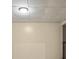 Basement with neutral walls, drop ceiling and access to an additional room at 6441 Michell Way, Douglasville, GA 30135