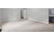 Spacious carpeted bedroom with view to bathroom and hallway at 6441 Michell Way, Douglasville, GA 30135