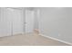 Bedroom with carpet flooring, neutral walls, and closet with double doors at 6441 Michell Way, Douglasville, GA 30135