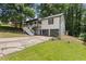 Exterior view of home with welcoming porch and two car garage at 6441 Michell Way, Douglasville, GA 30135