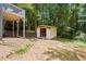 View of the backyard featuring a storage shed on a sunny day at 6441 Michell Way, Douglasville, GA 30135