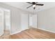Bedroom with hardwood floors, ceiling fan and closet at 6671 Gano Dr, Riverdale, GA 30274