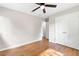 Bedroom with hardwood floors, ceiling fan and closet at 6671 Gano Dr, Riverdale, GA 30274