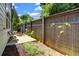 Cozy backyard patio with a wooden fence, perfect for outdoor relaxation and entertaining at 1858 Belmore Se St, Smyrna, GA 30080