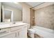 Inviting bathroom with a tub-shower combination, single sink vanity, and a toilet at 1858 Belmore Se St, Smyrna, GA 30080