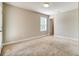 Cozy bedroom with a window, carpet, and neutral walls, providing a relaxing and comfortable space at 1858 Belmore Se St, Smyrna, GA 30080