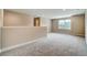 Spacious bonus room with neutral walls, plush carpet, and large window offering natural light at 1858 Belmore Se St, Smyrna, GA 30080