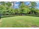 Spacious fenced in dog park with bench offers a place to relax and play at 1858 Belmore Se St, Smyrna, GA 30080