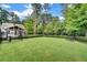 Fenced in dog park with a gazebo and bench provides a place to relax and play at 1858 Belmore Se St, Smyrna, GA 30080