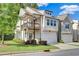 Charming two-story home featuring a covered balcony and attached two-car garage at 1858 Belmore Se St, Smyrna, GA 30080