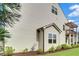 Side exterior of home featuring white siding, a small backyard with green bushes, and a gas meter at 1858 Belmore Se St, Smyrna, GA 30080