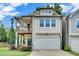 Inviting two-story home with a covered balcony and attached two-car garage at 1858 Belmore Se St, Smyrna, GA 30080