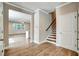 Welcoming foyer with hardwood floors, staircase, and an open view to the living area at 1858 Belmore Se St, Smyrna, GA 30080