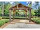 Relaxing gazebo sits among mature trees and manicured landscaping in this community at 1858 Belmore Se St, Smyrna, GA 30080