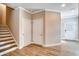 Hallway features hard wood floors and stairs going up on the left side at 1858 Belmore Se St, Smyrna, GA 30080