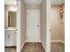 Hallway with a bathroom and carpeted closet at 1858 Belmore Se St, Smyrna, GA 30080