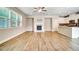 Spacious living room with fireplace, large window, and seamless flow to the modern kitchen at 1858 Belmore Se St, Smyrna, GA 30080