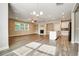Bright and airy living room featuring a fireplace, recessed lighting, and wood-look floors at 1858 Belmore Se St, Smyrna, GA 30080