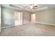Spacious main bedroom with tray ceiling and connecting bathroom with separate tub and shower at 1858 Belmore Se St, Smyrna, GA 30080