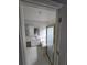 Bright bathroom featuring tub with glass door and ample cabinet space at 2670 Henderson Chase Ct, Tucker, GA 30084