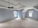 Spacious bedroom with plush carpeting, neutral paint, a ceiling fan, and plenty of natural light at 2670 Henderson Chase Ct, Tucker, GA 30084