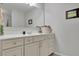 Contemporary bathroom vanity featuring a decorative mirror and ample counter space at 3940 Frasier Dr, Cumming, GA 30028