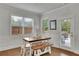 Bright breakfast nook features natural light, hardwood floors and access to the backyard at 3940 Frasier Dr, Cumming, GA 30028