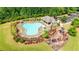 Aerial view of a sparkling community pool with a playground at 3940 Frasier Dr, Cumming, GA 30028