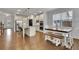 Spacious kitchen and breakfast nook featuring a large island, stainless appliances, and hardwood floors at 3940 Frasier Dr, Cumming, GA 30028