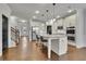 Beautiful kitchen with a large island, stainless steel appliances, and stylish bar stools at 3940 Frasier Dr, Cumming, GA 30028