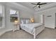 Serene main bedroom with tray ceilings, neutral tones, and ample natural light at 3940 Frasier Dr, Cumming, GA 30028