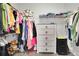 Organized walk-in closet featuring shelving, hanging rods, and ample storage space at 3940 Frasier Dr, Cumming, GA 30028