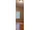 Bright bedroom with hardwood floors and natural light from the large window at 519 Roy Sw St, Atlanta, GA 30310