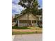 Traditional home featuring a covered front porch and well-maintained landscaping at 519 Roy Sw St, Atlanta, GA 30310