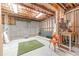 Unfinished basement space with exposed framework, lighting, and concrete flooring at 5960 Overlook Club Cir, Suwanee, GA 30024