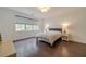 Bedroom with wood floors, large window, and contemporary decor at 5960 Overlook Club Cir, Suwanee, GA 30024