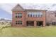 Brick house exterior with backyard and lawn at 5960 Overlook Club Cir, Suwanee, GA 30024