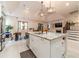 Open-concept kitchen features stainless steel appliances, a large island, and seamless integration with living spaces at 5960 Overlook Club Cir, Suwanee, GA 30024