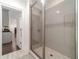 Tiled shower with glass door and modern fixtures at 5960 Overlook Club Cir, Suwanee, GA 30024