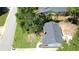 Aerial view of a single-Gathering home with lawn and quiet street at 2039 Gober Ave Se, Smyrna, GA 30080