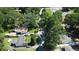 An overhead shot showcases the real estate's location surrounded by lush, green trees and nearby neighborhood amenities at 2039 Gober Ave Se, Smyrna, GA 30080