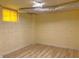Unfinished basement features wood-look floors, a window, and exposed ductwork at 2039 Gober Ave Se, Smyrna, GA 30080