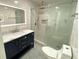 Bathroom featuring a glass shower, vanity with marble countertop, and modern toilet at 2039 Gober Ave Se, Smyrna, GA 30080
